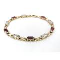 Red and white CZ bracelet set in 9ct gold