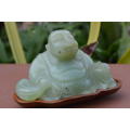 jade stone laughing buddha on wood base