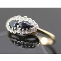 DAINTY ELLIPTICAL SAPPHIRE AND DIAMOND RING. 9ct YELLOW AND WHITE GOLD. VINTAGE ENGLISH
