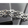 ROMANTIC AND FUNKY INTERLINKED HEART DESIGN IN STERLING SILVER. VINTAGE.