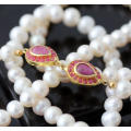 VERY LONG 83cm PEARL NECKLACE WITH ELEGANT FEATURE NATURAL RUBIES IN GOLD-HUED STERLING SILVER