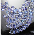 DRAMATIC AND ELEGANT TANZANITE AND STERLING SILVER WAVE-LIKE RIGID FEATURE PENDANT. BOX CHAIN