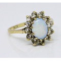 OPAL VINTAGE 9CT YELLOW AND WHITE GOLD RING WITH WHITE STONE ACCENTS. 375