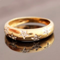 VINTAGE ENGLISH SHANK STYLE HALF ROUND 9CT YELLOW DIAMOND RING WITH GROOVED STAR-SHAPE MOTIFS. 375