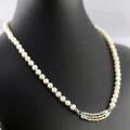 CLASSY SINGLE STRAND NATURAL PEARL NECKLACE WITH SOLID STERLING SILVER TWISTED STRAND PENDANT