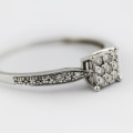 WHITE 9CT GOLD DIAMOND RING. COMES WITH INDEPENDENT AUTHENTICATION and EVALUATION CERT FOR R13`000