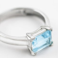 9CT WHITE GOLD BLUE TOPAZ SOLITAIRE RING. COMES WITH JEWELLER CERTIFICATE R10`000