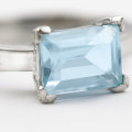 9CT WHITE GOLD BLUE TOPAZ SOLITAIRE RING. COMES WITH JEWELLER CERTIFICATE R10`000
