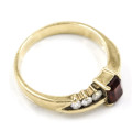 SOLID 9CT YELLOW GOLD GARNET AND CUBIC ZIRCONIA RING WITH R8`500 JEWELLER EVALUATION CERT