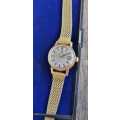 1945 omega automatic geneve 566.002 ladies watch with Fischer 14kt rolled gold strap