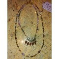 Lovely multi coloured beaded double necklace with brass centrepiece: DN1
