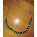 short beaded necklace in green on stainless steel chain. SN10
