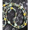 Beautiful long beaded necklace in greens and golds. LN4