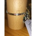 Tila metallic green bracelet . B83