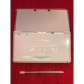 pink Nintendo 3DS console (EUR) with charging dock