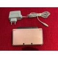 pink Nintendo 3DS console (EUR) with charging dock