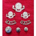 Complete set of St. Johns Ambulance insignia with three different sizes of buttons.