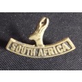A Second World War South Africa shoulder title. The cast brass badge was made and worn in Egypt .