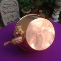A Vintage Copper Kettle with a Brass Handle.