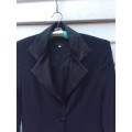 A Beautiful Black Jacket with a Satin Trim.  Size: 1.by Jenny le Roux of Habits, Cape Town.