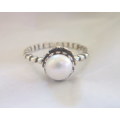Genuine pearl set in a delightful sterling silver flower crown ring.