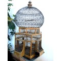 A very ornate and decorative wooden and metal bird cage, canary, finch, budgie