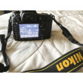 Nikon D7000 with 55-200mm lens (Pro digital camera)