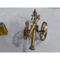 Brass cannon with soldier