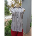 Pretty black and white striped polycotton button down top . Sleeveless with open V collar. Size 30/6