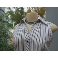 Pretty black and white striped polycotton button down top . Sleeveless with open V collar. Size 30/6