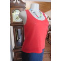 Chic bright red sleeveless top by `Legit` in size 32/8. In textured floral stretch polyester. As new
