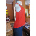 Chic bright red sleeveless top by `Legit` in size 32/8. In textured floral stretch polyester. As new