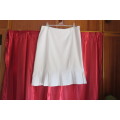 Up style off-white pencil skirt with pleated seam area. Size 40/16 by 'Inspire'.
