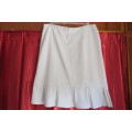 Up style off-white pencil skirt with pleated seam area. Size 40/16 by 'Inspire'.