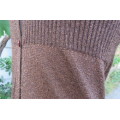 Golden brown knitted cardigan with gold thiread.Close with 3 buttons. Scooped neckline. Size 32/8.