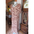 Button down dress in light brown with darker patches and dark brown flowers. Size 44/20.