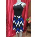 Fashion skirt size 32/8  in royal blue, black and white zig-zag pattern by `Fashion Express`.As new!