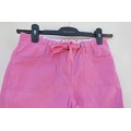Rosepink pants for girl of 11 to 12 years old. Cargo pockets on front. Dummies at back.
