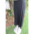 You can pair this smart black A-line skirt in 2 layers with a range of matching tops size 36/12.