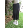 You can pair this smart black A-line skirt in 2 layers with a range of matching tops size 36/12.