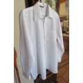 White men's long sleeve shirt by 'Banned'. Front pocket size XL-chest 127 cm. In polycotton fabric.