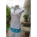 Cool white sleeveless top with front under bust gathering. Low banded V size 36/12 with collar.