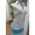 Cool white sleeveless top with front under bust gathering. Low banded V size 36/12 with collar.