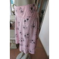 Lovely coral colour wide A-line skirt with black flowers.Yoked waist size 34/10 by `Legit`. As new.