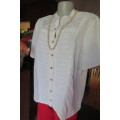 Top of the line rich cream short sleeve top by 'Donatella' size 42/18. As new
