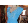 Beautiful light turquoise ankle length dress with cream embroidery on front size 32/8.