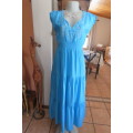 Beautiful light turquoise maxi dress with cream embroidered front and tiered skirt.Size 32/8.As new