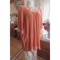 Brick colour long loose hanging top in creased polyester and rayon blend size 48/24.