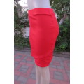 Sexy bright red bodycon mini skirt by `RT` in size 36/12. In stretch textured polyester stretch.