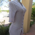 Chic very light lilac knitted top in rayon and nylon knit. Size 32/8. By TOPICS. New Condition.